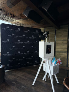 Glam Photo Booth, branded photo activation with branded back screen and step and repeat backdrop